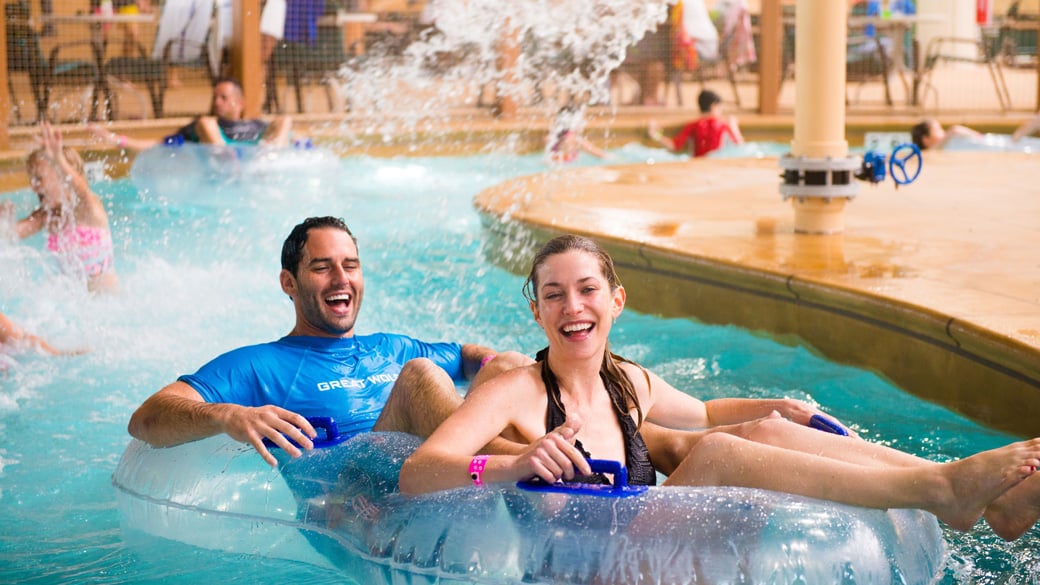 Two people enjoying on the lazy river water ride
