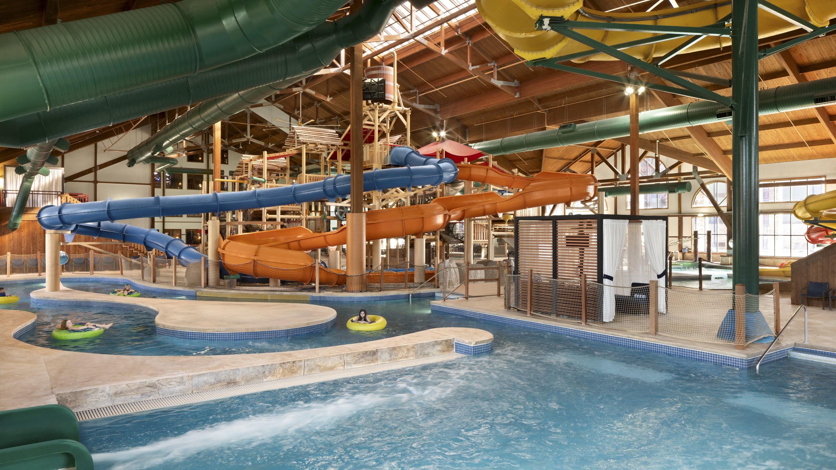 guests enjoying riding tubes in lazy river water aprk attraction
