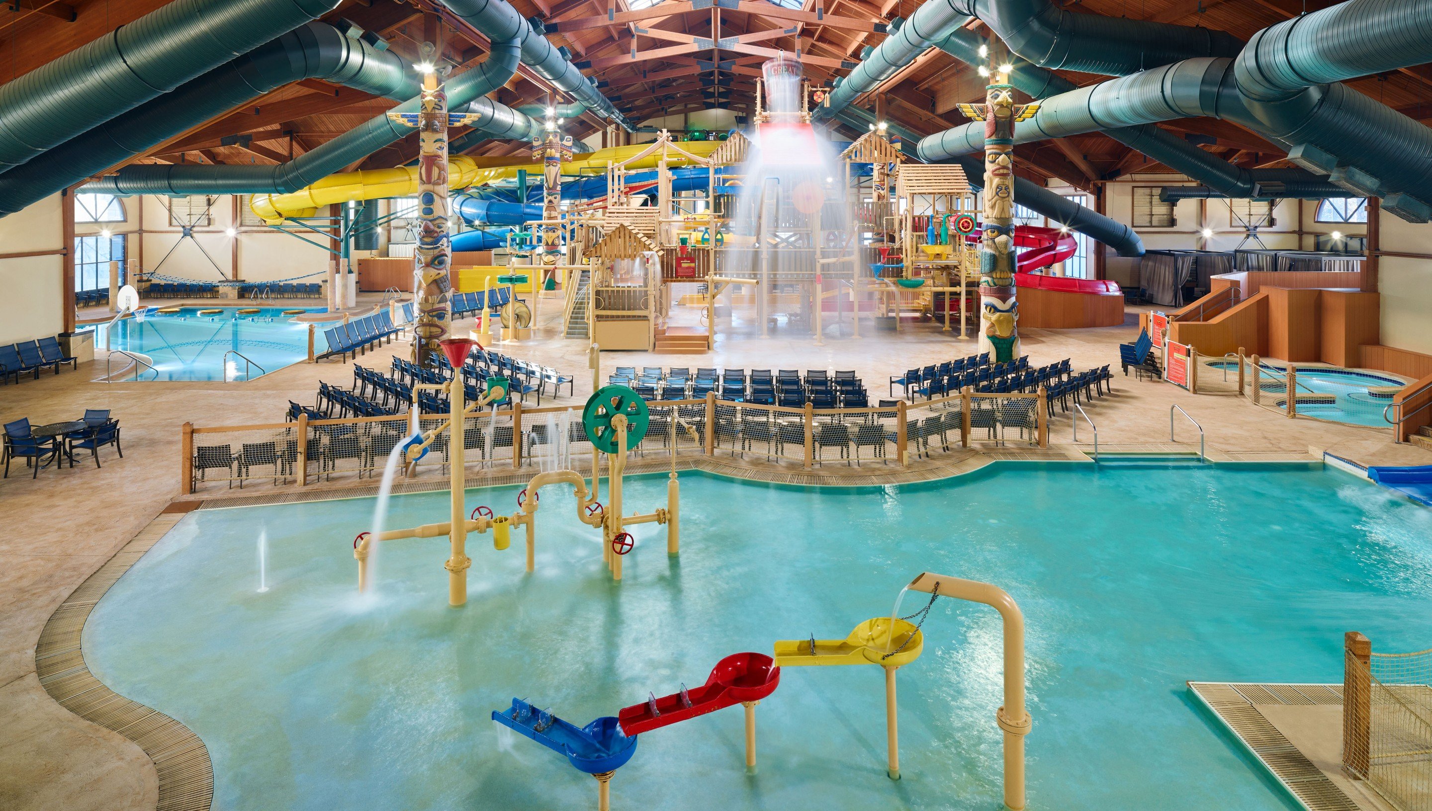 Indoor water park featuring slides, pools, and play areas for families and children.