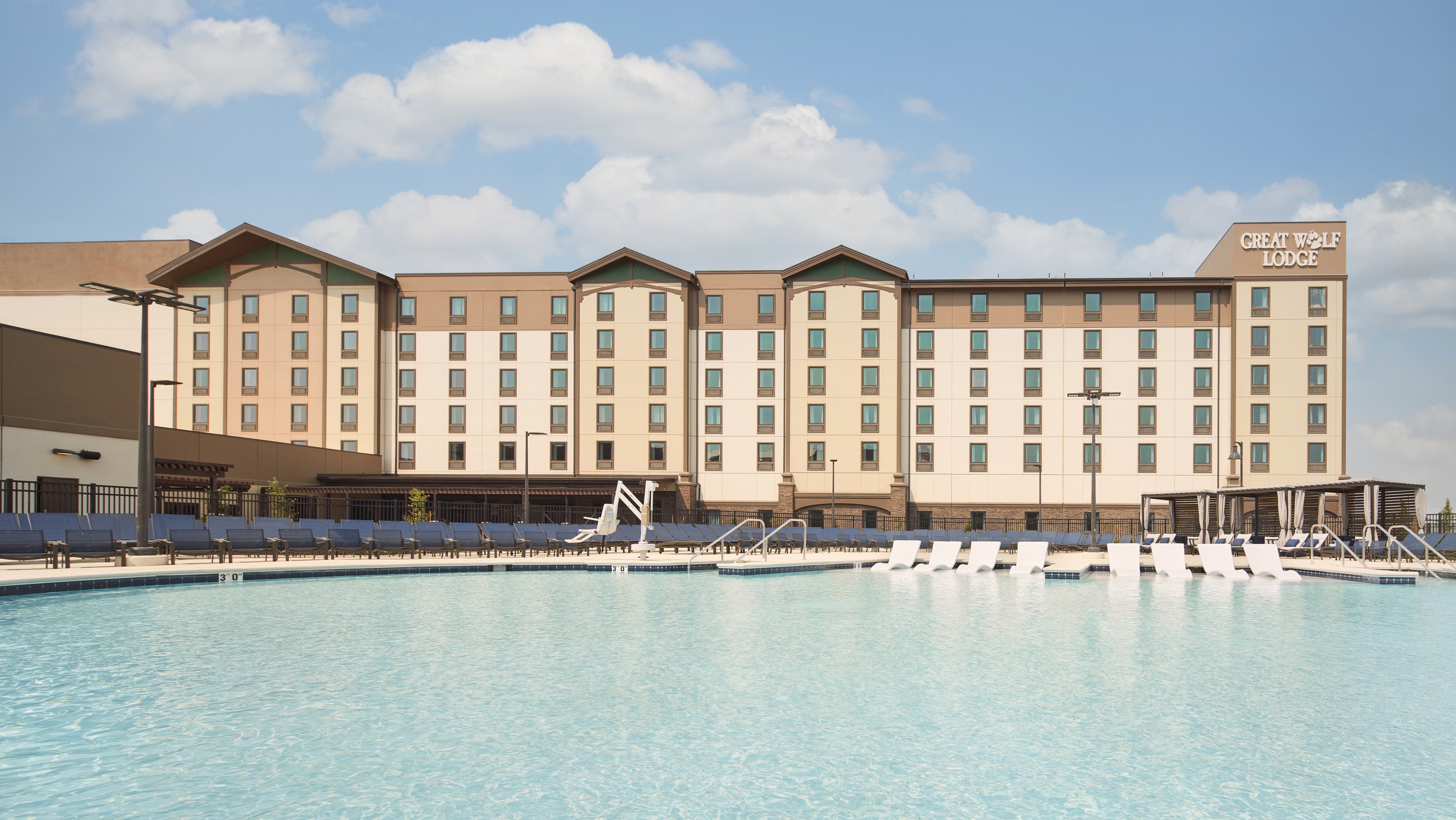 outdoor swimming pool with lounge chairs