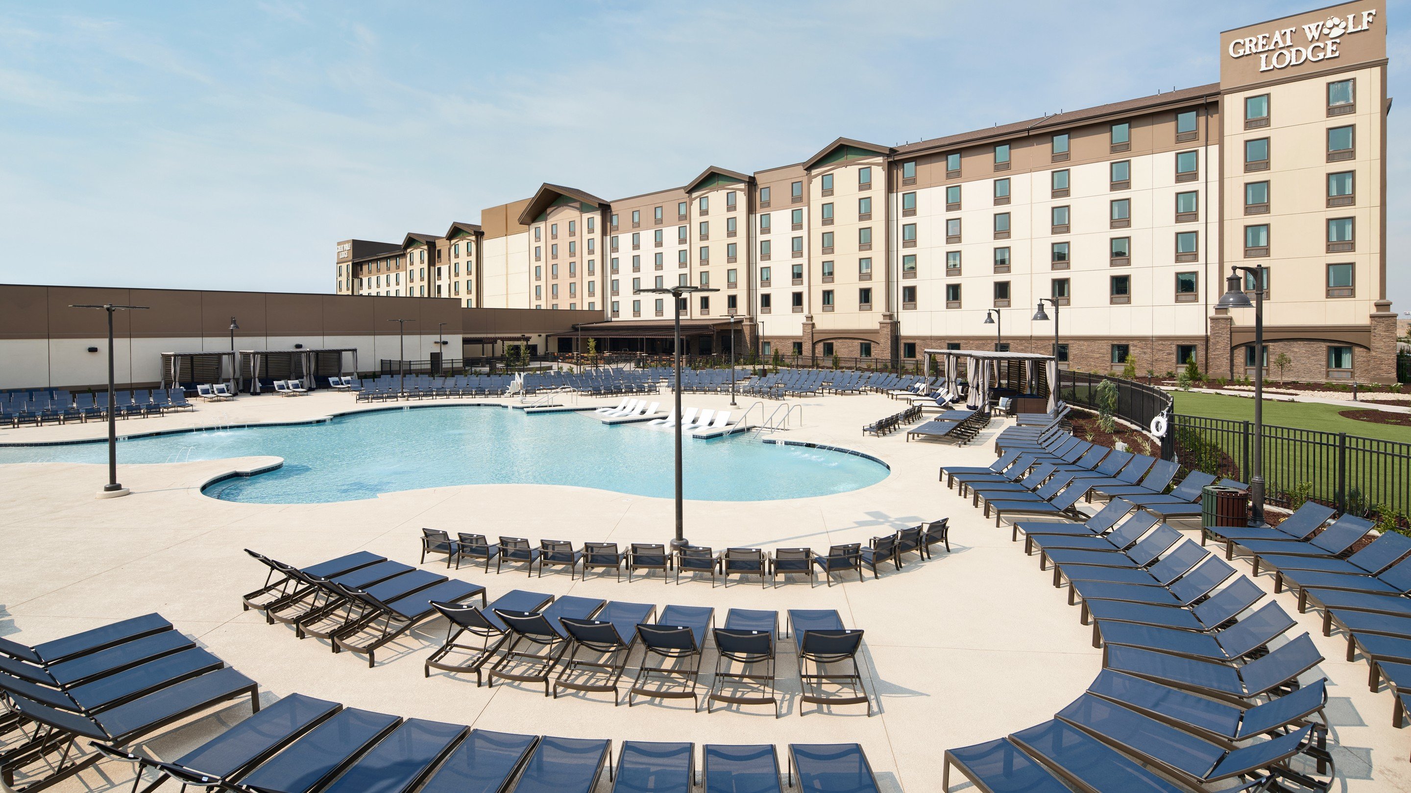 dozens of beach chairs near an outdoor pool