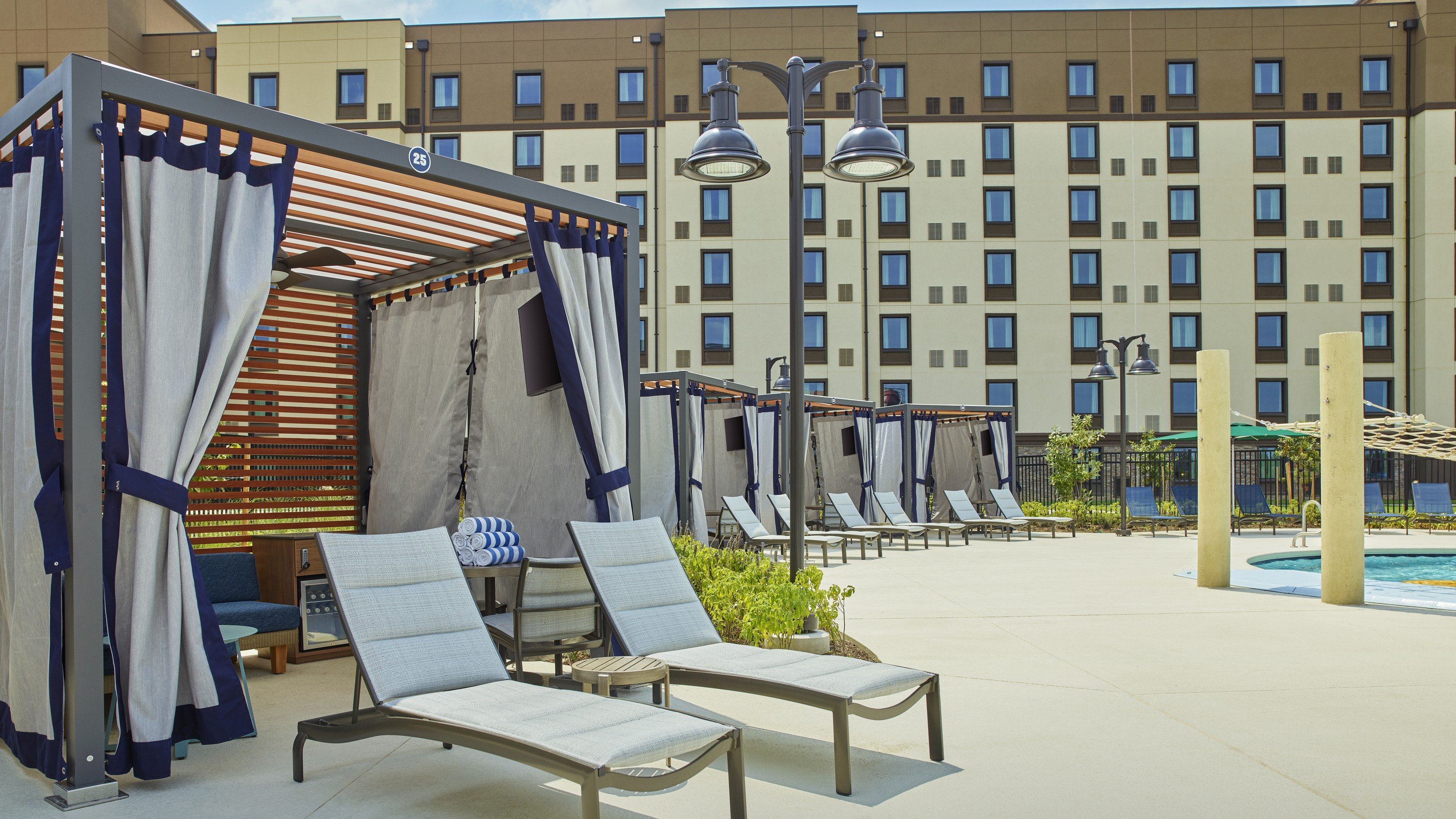 beach chairs near an outdoor pool