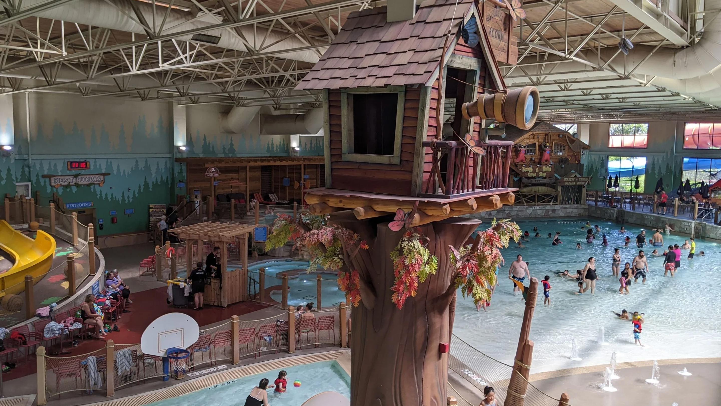 treehouse in an indoor water park with hot tubs in the background